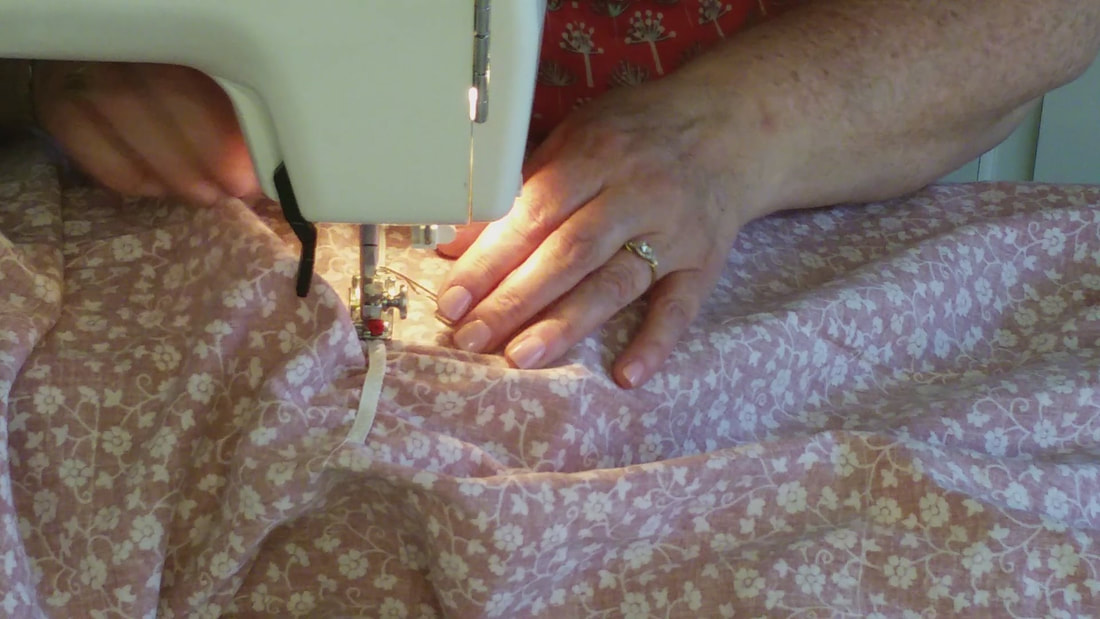 Elastic being sewn onto the back panel.