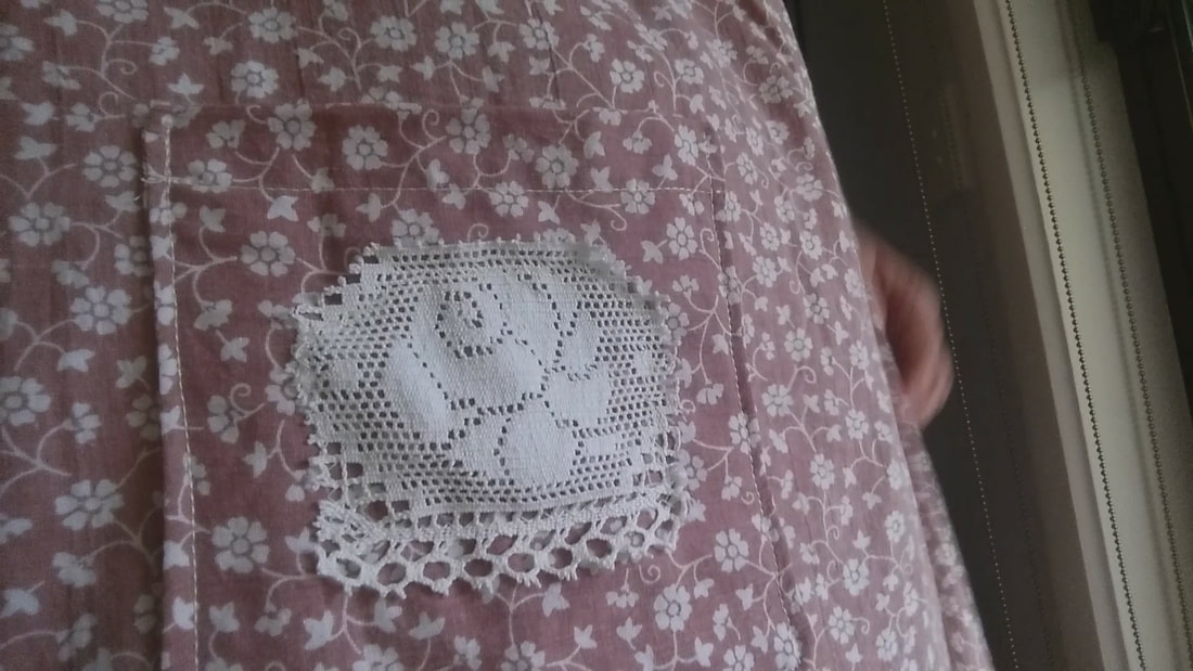 Pocket with lace detail, sewn into place.